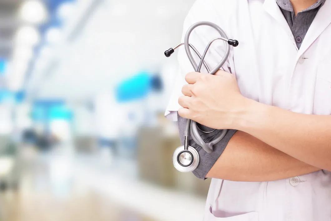 Physician holding a stethoscope